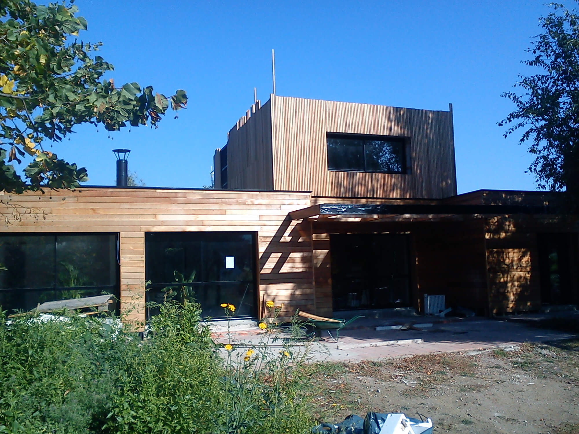 Réalisation d'un bardage d'une maison avec nos bardages